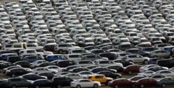 FILE - Autos line the dock after coming off a ship from Japan at the Port of Portland, in Portland, Oregon, June 6, 2006.
