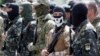 Members of the "Donbas Battalion" take part in a swearing-in ceremony near Kyiv, June 23, 2014.