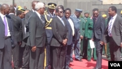 FILE: The Zimbabwean leader bid farewell to former secretary of the President and Cabinet, Charles Utete, on Tuesday, July 19, 2016.