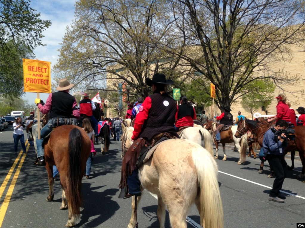 The Cowboy and Indian Alliance stages a "Reject and Protect" protest around Capitol Hill against the Keystone XL oil pipeline project, Washington D.C., April 22, 2014. (Diaa Bekheet/VOA)