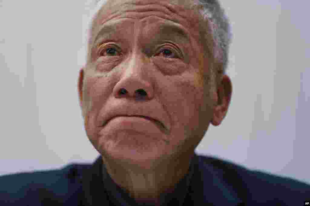 One of three protest leaders, Reverend Chu Yiu-ming, weeps as he announces that he and two other pro-democracy leaders will surrender to police, during a news conference, in Hong Kong, Dec. 2, 2014.