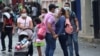  People wear face masks near the Venezuelan-Colombia border.