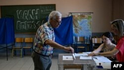 A man casts his vote during the European Parliament election, in Athens, Greece, on June 9, 2024.