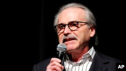 FILE - In this Jan. 31, 2014, photo, David Pecker, chairman and CEO of American Media, addresses those attending a Super Bowl party in New York.