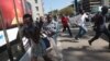 Protesters disperse in Harare Aug. 24, 2016, after Zimbabwe police fired tear gas, water cannon and gunshots to stop hundreds of youths rallying against the government of President Robert Mugabe.