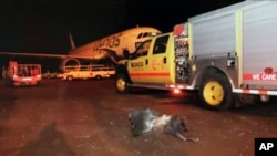 FILE - This photograph released by the state-run Saudi Press Agency shows debris on the tarmac of Abha Airport after an attack by Yemen's Houthi rebels, in Abha, Saudi Arabia, June 12, 2019. 