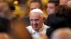 Pope Francis smiles as he leaves after an audience with Italian athletes in St. Peter's Basilica at the Vatican, Dec.19, 2014.