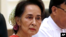 FILE - Myanmar's leader Aung San Suu Kyi, left, attends the bilateral meeting with Chinese President Xi Jinping at the president house in Naypyitaw Myanmar, on Jan. 18, 2020.