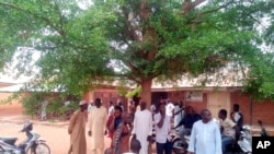 Parents of abducted children of the Salihu Tanko Islamic School wait for news on their children in Tegina, Nigeria, June 1, 2021. A number of students were abducted Sunday and one person was killed at a school in Nigeria's north central Niger State.