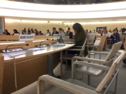 FILE - The empty seats for the delegation of Saudi Arabia are seen during a session of the Human Rights Council at the United Nations in Geneva, Switzerland, Sept. 23, 2019.