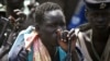 Rebel fighters listen to their commander in rebel-controlled territory in Upper Nile State, Feb. 15, 2014. 