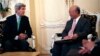 U.S. Secretary of State John Kerry, left, talks with Atomic Energy Agency (IAEA) Director General Yukiya Amano during a meeting at at hotel in Vienna, Austria, June 29, 2015. 