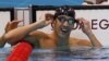 Michael Phelps of the U.S. celebrates winning gold in the men's 100m butterfly final during the London 2012 Olympic Games at the Aquatics Centre, August 3, 2012. 
