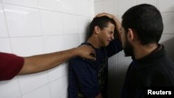A relative of a Palestinian who was killed at the Israel-Gaza border reacts at a hospital, in the southern Gaza Strip, May 6, 2018.