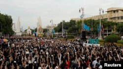 Pro-democracy protesters attend a rally to demand the government to resign, to dissolve the parliament and to hold new elections under a revised constitution, near the Democracy Monument in Bangkok, Thailand, Aug. 16, 2020.