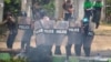 This screengrab provided via AFPTV and taken from a broadcast by Myitkyina News Journal on March 27, 2021 shows security forces crack down protesters during a demonstration against the military coup in Myitkyina in Myanmar's Kachin state.