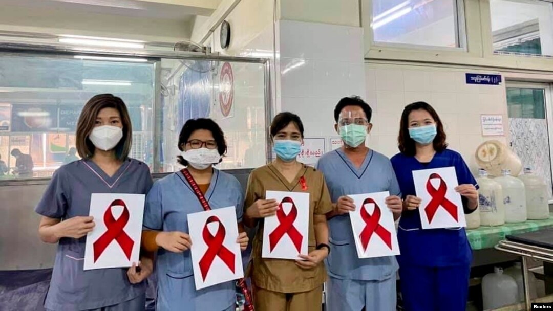 Healthcare workers pose for a picture at the Ayawaddy coronavirus disease (COVID-19) treatment center in Mandalay, Myanmar February 3, 2021. Prof Cho Mar Lwin/Handout via REUTERS ATTENTION EDITORS - THIS IMAGE HAS BEEN SUPPLIED BY A THIRD PARTY. NO RESALE