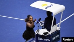 Serena Williams of the United States yells at chair umpire Carlos Ramos in the women's final against Naomi Osaka of Japan at the 2018 U.S. Open tennis tournament in New York, Sept. 8, 2018.