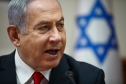 FILE - Israeli Prime Minister Benjamin Netanyahu chairs the weekly cabinet meeting in Jerusalem, March. 8, 2020.
