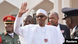 FILE - Nigeria President Muhammadu Buhari, waves after a meeting in Abuja, Nigeria, Jan. 9, 2017. Buhari is currently on indefinite medical leave in Britain. 