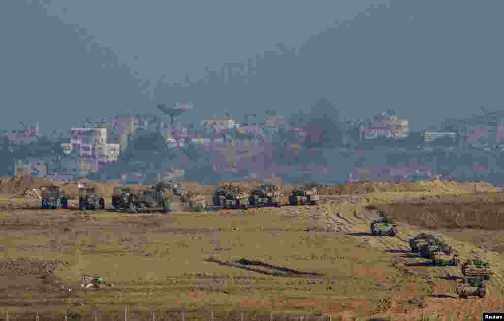 Israeli army tanks and armored vehicles are seen in Gaza near the border with Israel, July 30, 2014. 