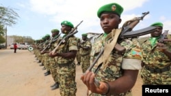 FILE - African Union Mission in Somalia (AMISOM) peacekeepers from Burundi stand in formation during a ceremony as they prepare to leave the Jaale Siad military academy after being replaced by the Somali military in Mogadishu, Somalia, Feb. 28, 2019. 