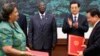 Chinese President Hu Jintao (2nd R) and Ghana's President John Atta Mills (2nd L) attend a signing ceremony after a welcoming ceremony at the Great Hall of the People, in Beijing, China, September 2010.