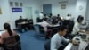 FILE - Cambodian online news outlet 'Fresh News' staff members work in their newsroom in Phnom Penh, May 21, 2018.
