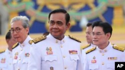 រូប​ឯកសារ៖ លោក​នាយករដ្ឋមន្ត្រី​ថៃ Prayuth Chan-ocha ដឹកនាំ​គណៈរដ្ឋមន្ត្រី​ទាំង​៣៦នាក់​ស្បថ​ចូល​កាន់​តំណែង​នៅ​ក្នុង​ក្រុង​បាងកក កាលពី​ថ្ងៃទី១៦ ខែកក្កដា ឆ្នាំ២០១៩។
