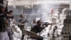 Members of the Free Syrian Army are seen at a front line in al-Mid area in Aleppo city in northern Syria, October 11, 2012. 