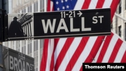 FILE - The Wall Street sign is pictured at the New York Stock Exchange in the Manhattan borough of New York City.