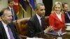 President Barack Obama, flanked by National Governors Association Chairman, Delaware Governor Jack Martell, and NGA Vice Chair, Oklahoma Governor Mary Fallin, with Tim Geithner (R), meets with the NGA executive committee regarding the fiscal cliff.