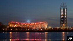 A light show is seen at the Bird's Nest Stadium during a rehearsal for the opening ceremony of the Beijing 2022 Winter Olympics, in Beijing, China, Jan. 27, 2022. 