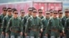 Members of Chinese People's Liberation Army (PLA) Air Force Red Falcon aerobatic team attend the China International Aviation and Aerospace Exhibition in Guangdong province, China, Sept. 28, 2021. 