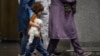 Afghan evacuees arrive at Incheon International Airport in Incheon, South Korea, Aug. 26, 2021, after fleeing from their country following the Taliban's military takeover of Afghanistan. 