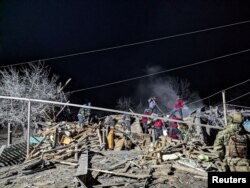 Rescuers work at the site of a Russian missile strike in an area of Pokrovsk, in Donetsk region, Ukraine, on Jan. 6, 2024. (Press service of the State Emergency Service of Ukraine in Donetsk region via Reuters)