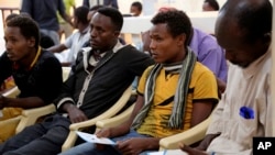 FILE - Ethiopian migrants gather at the International Organization for Migration center in the port city of Aden, Yemen, Jan. 2, 2017.