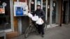 E-bike delivery worker Deqing Lian, 53, says he hopes to continue working and not rely on the government. “We still have our hands and our feet,” he said. “But without these e-bikes, we really don’t have any other means. We are simply too old.” 