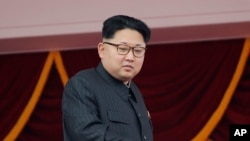 FILE - North Korea's leader Kim Jong Un watches a parade from a balcony at the Kim Il Sung Square in Pyongyang.