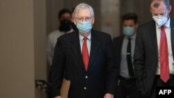 FILE - Then-Senate Majority Leader Mitch McConnell, Republican of Kentucky, walks to his office from the Senate floor at the U.S. Capitol in Washington, Dec. 18, 2020. 