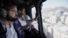 This handout picture released by the Chilean Presidency shows Chile's President Gabriel Boric flying over Santiago in a helicopter during a blackout on Feb. 25, 2025.
