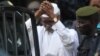 Former Chadian dictator Hissene Habre is escorted by military officers after being heard by a judge on Jul. 2, 2013 in Dakar, Senegal.