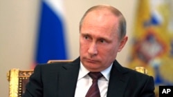 Russia's President Vladimir Putin during a meeting with Russian Parliament speakers at the Novo-Ogaryovo residence outside Moscow, Sept. 2, 2013. 