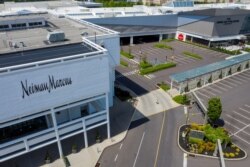 A Neiman Marcus department store stands next to empty parking lots at the King of Prussia Mall which remains closed due to the ongoing outbreak of the COVID-19 in Upper Merion Township, Pennsylvania, May 21, 2020.
