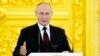 Russian President Vladimir Putin speaks in the Kremlin, in Moscow, Russia, Dec. 1, 2021.
