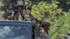 Government soldiers heading to strike rebel-held positions near Rutshuru, DRC, May 20, 2012.