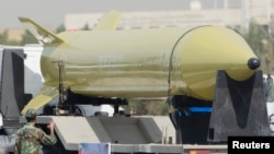 A military truck carrying a Shahab-3 missile drives by during a military parade commemorating the anniversary of the start of the 1980-1988 Iran-Iraq war, in Tehran, September 21, 2008. 