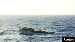 A picture released by the Australian Maritime and Safety Authority (AMSA) shows a boat which according to the AMSA was taken mid-morning before the boat sank near Christmas Island June 27, 2012.
