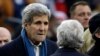 U.S. Secretary of State John Kerry, left, speaks to New England Patriots owner Robert Kraft before the Patriots and the Denver Broncos play in Foxborough, Mass., Nov. 2, 2014.