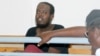 Hassan Hanafi Haji sits inside Mogadishu's military court during a hearing for his alleged role in the killings of Somali journalists, in Mogadishu, Somalia, March, 3, 2016. 